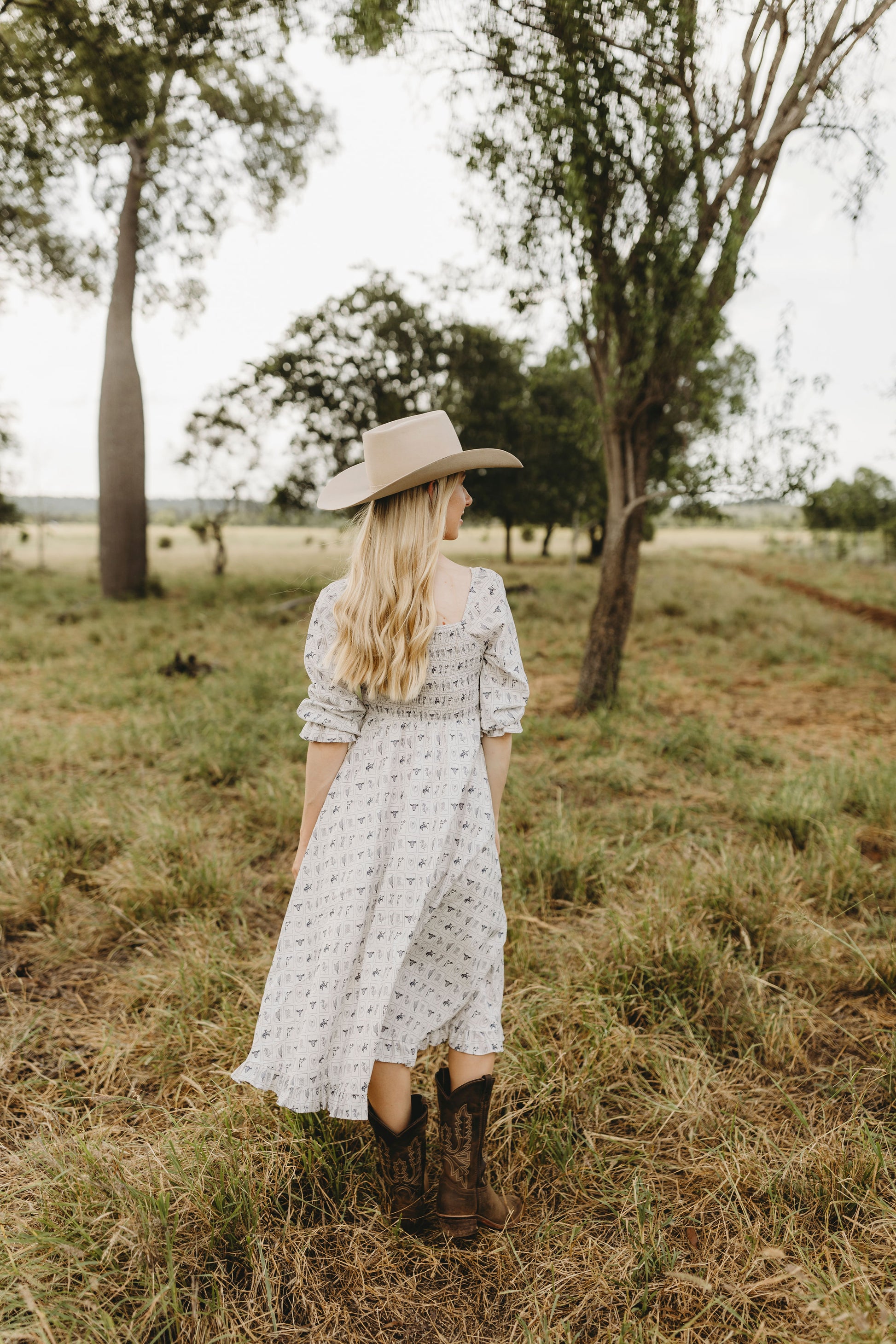 western midi dress Drew Battersea Floral Print / X-Large Adjustable straps and a flattering drop waist make it comfortable and stylish for any occasion Patched Western Midi Dress, Latte